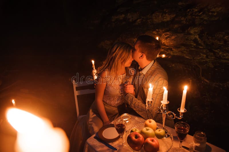 Romantic Dinner Of A Young Couple By Candlelight In The Mountain