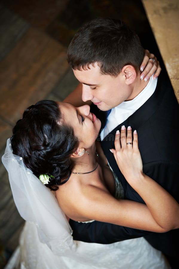 Romantic embrace bride and groom