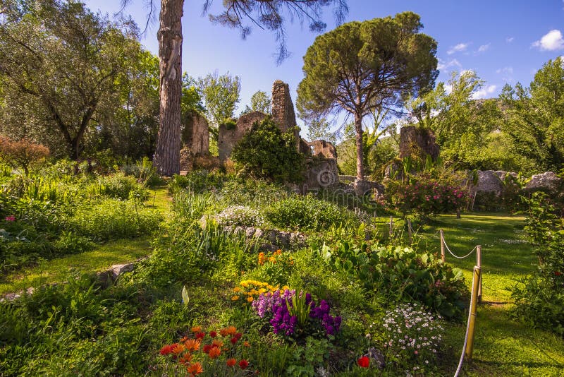 The romantic garden of Ninfa with ruins and flowers