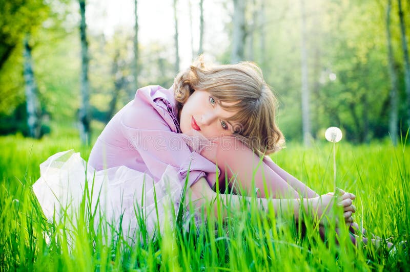 Romantic girl with dandelion