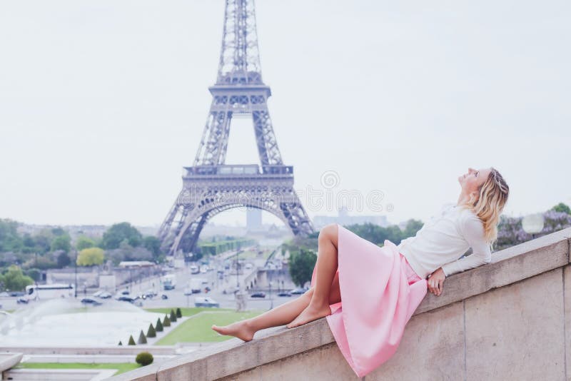 Romantic girl in Paris, fashion woman near Eiffel tower