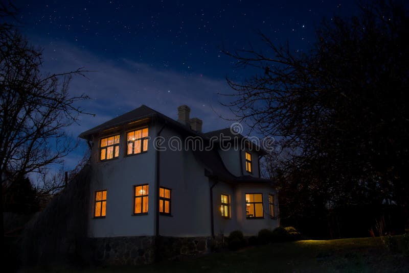 Romantic house with a light in the window. Night landscape. Romantic house with a light in the window. Night landscape.