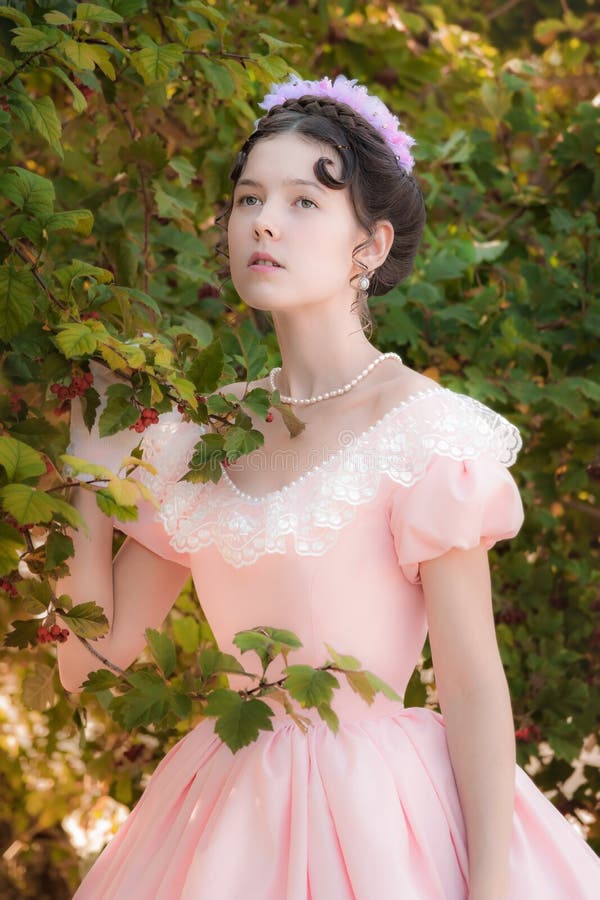 Romantic Innocent Girl in an Evening Dress in the Garden Stock Photo ...