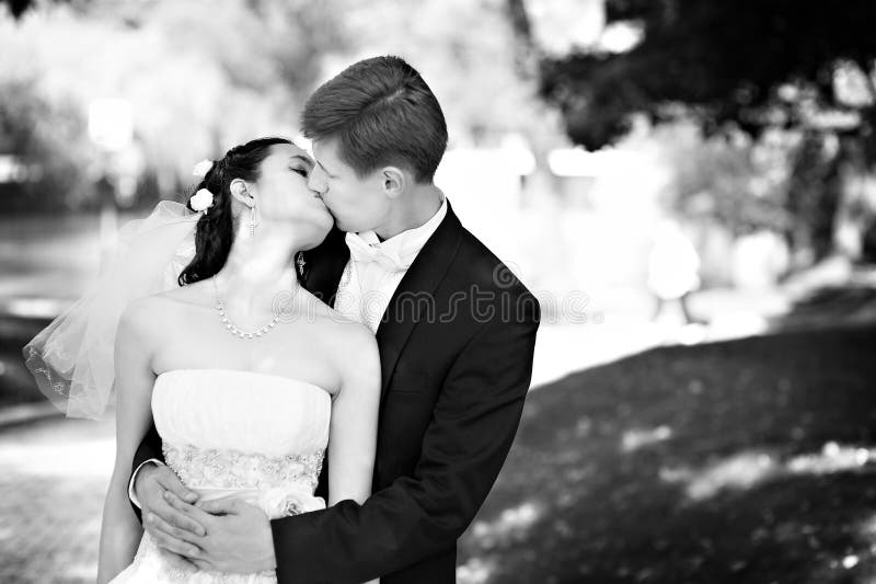 Romantic kiss bride and groom