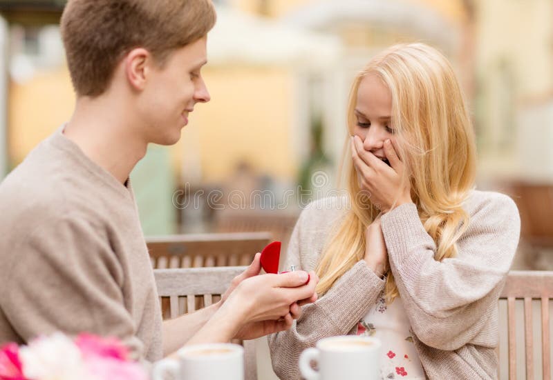 Romantic man proposing to beautiful woman stock photos Romantic man proposing to beautiful woman stock photos