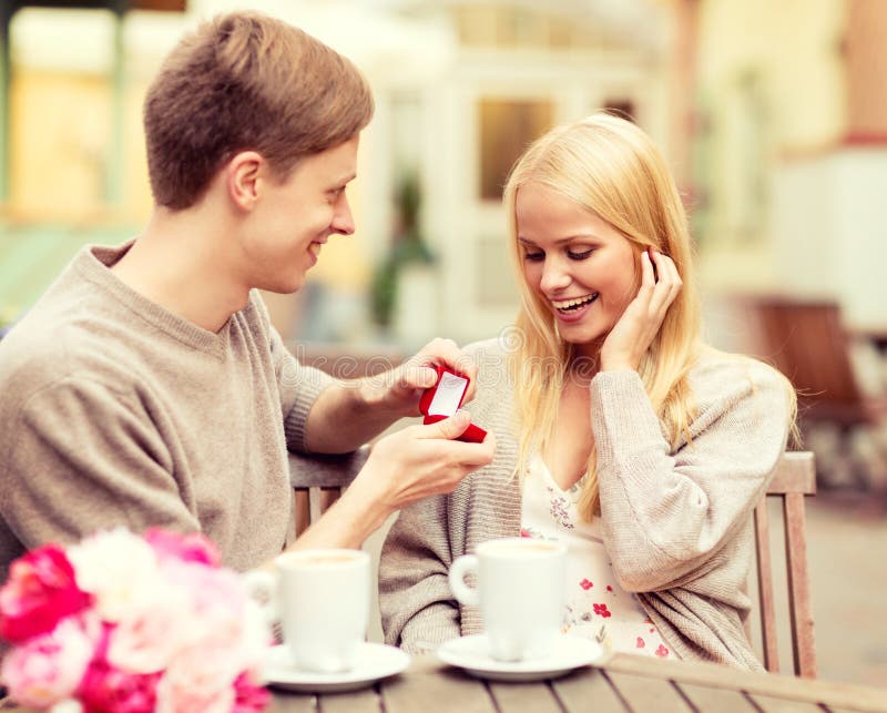 Romantic man proposing to beautiful woman royalty free stock image Romantic man proposing to beautiful woman royalty free stock image