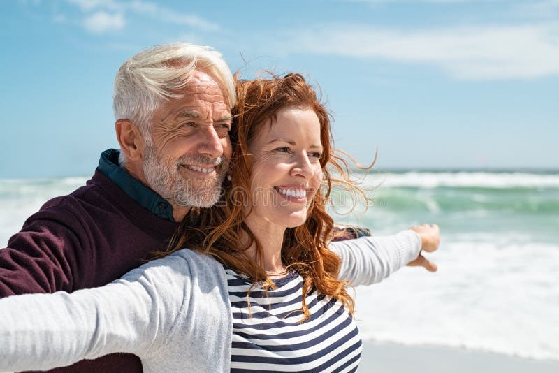 Romantic mature couple enjoying beach