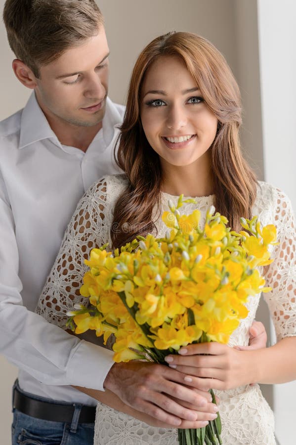 Romantic Moment Portrait Of Beautiful Young Couple Standing While 