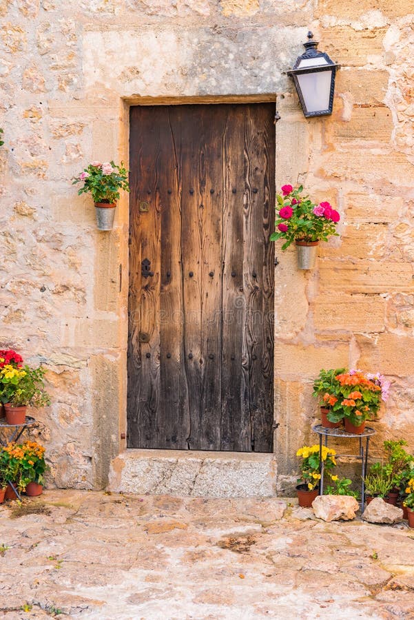 Romantic old wood front door with flowers decoration