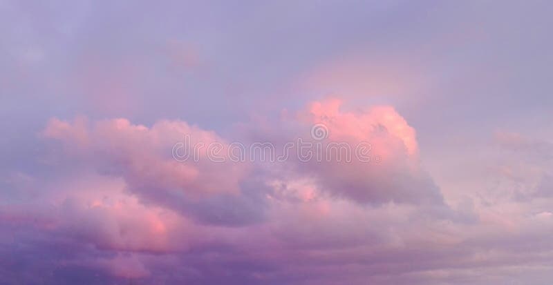 Wallpaper romantic panorama of azure sky with pink clouds