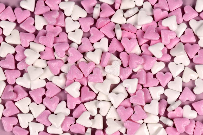 Romantic pink and white heart shaped sugar desser sprinkle background