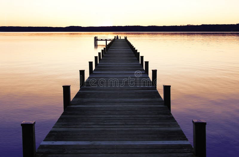 Romantic scenery starnberg lake, at sunset. Romantic scenery at starnberg lake, with boardwalk at sunset stock photography Romantic scenery starnberg lake, at sunset. Romantic scenery at starnberg lake, with boardwalk at sunset stock photography