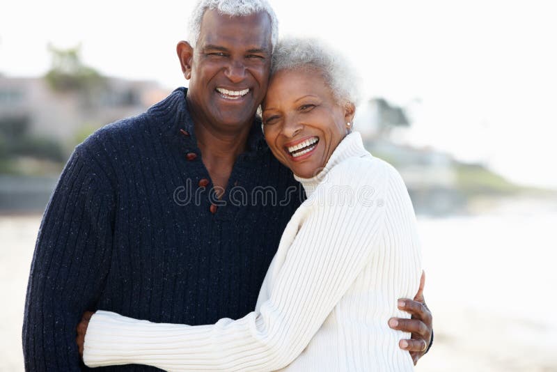 Romantic Senior Couple Hugging On Beach stock photography