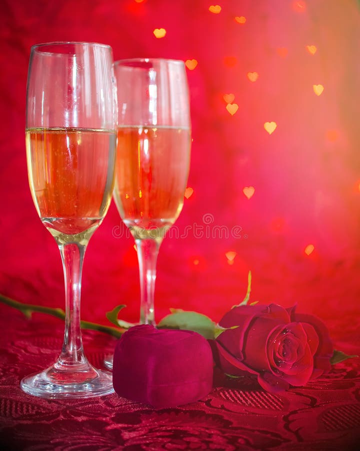 Romantic still life with champagne, gift box and red rose stock image Romantic still life with champagne, gift box and red rose stock image