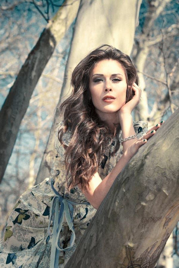 Romantic summer woman portrait portrait in treetop