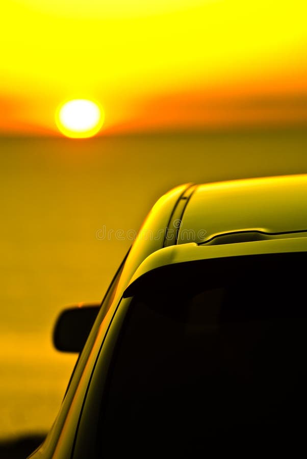 Car Parked at Sunset stock photo. Image of sedan, glow 5192594