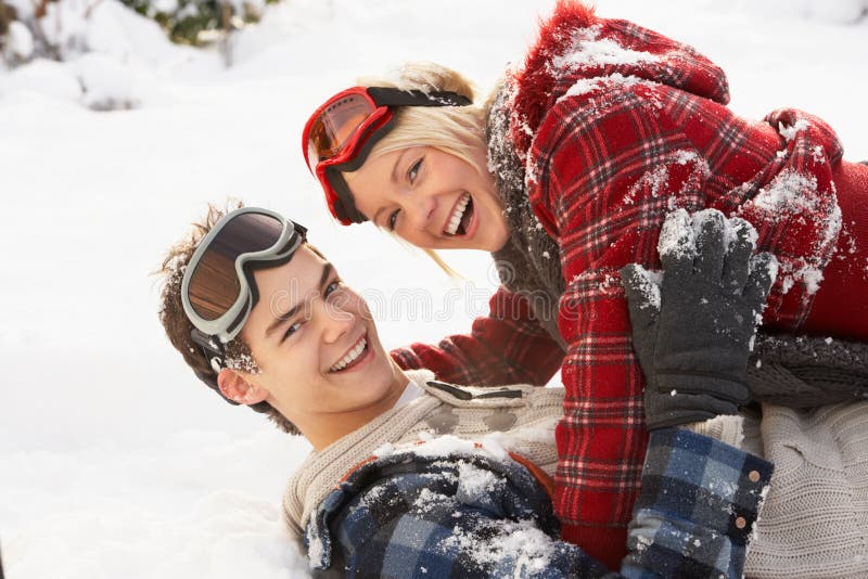 Romantic Teenage Couple Having Fun In Snow