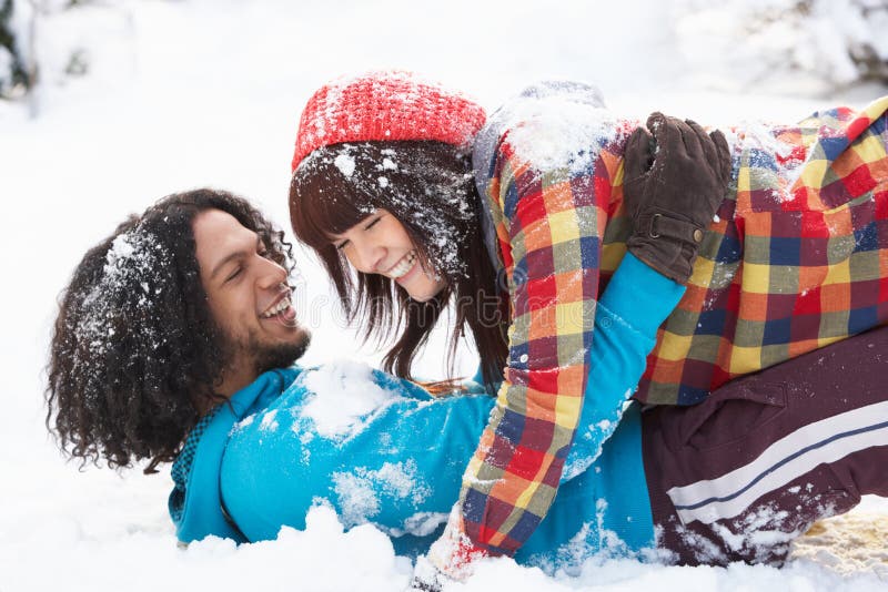 Romantic Teenage Couple Having Fun In Snow