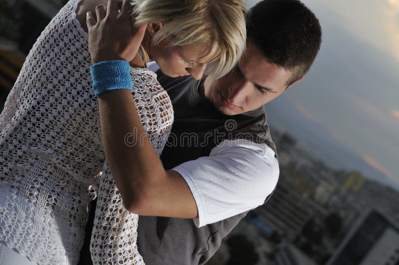 Romantic urban couple dancing outdoor