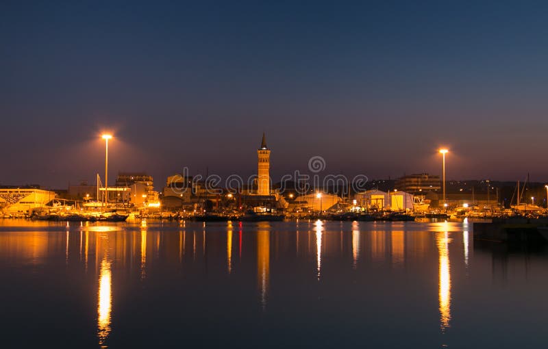 Romantic view of Civitanova Marche harbor at night.