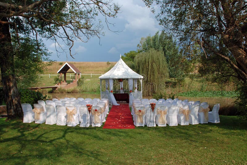 Image of an romantic outdoor style wedding venue setting. Image of an romantic outdoor style wedding venue setting.