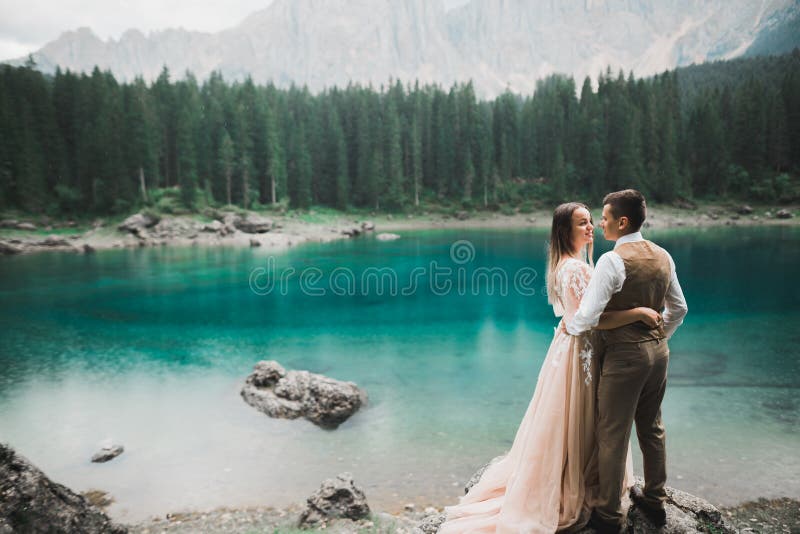 Romantic Wedding Moment Couple Of Newlyweds Smiling Portrait Bride And Groom Hugging Near A