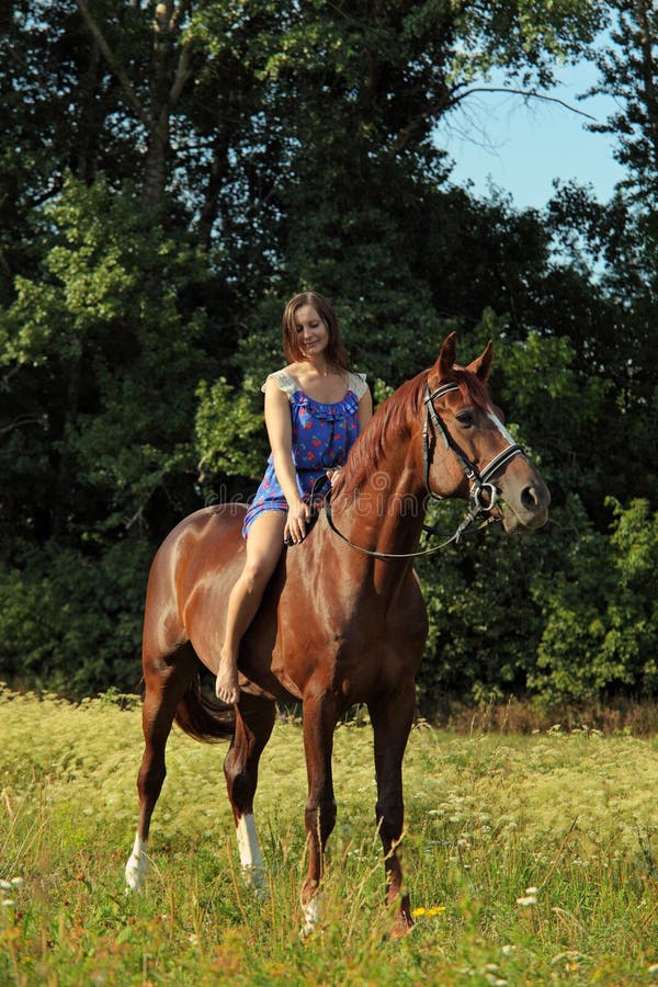 Romantic woman bareback riding in evening