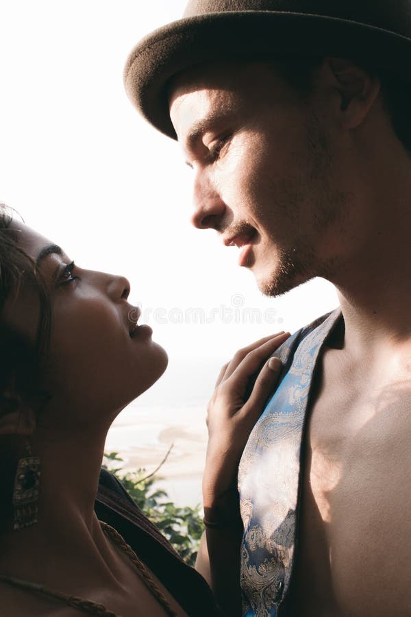 Premium Photo  Two young lovers. profiles of romantic couple looking at  each other