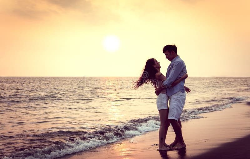 Romantic Young Couple Hug on the Beach at Sunset Stock Image - Image of ...