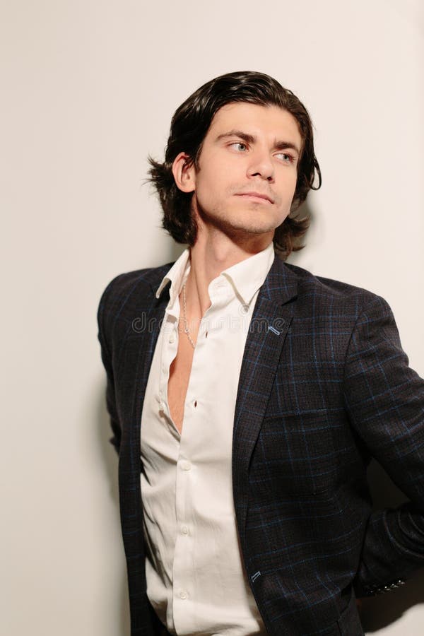 Romantic Young Man in a White Shirt and Black Jacket. Stock Photo