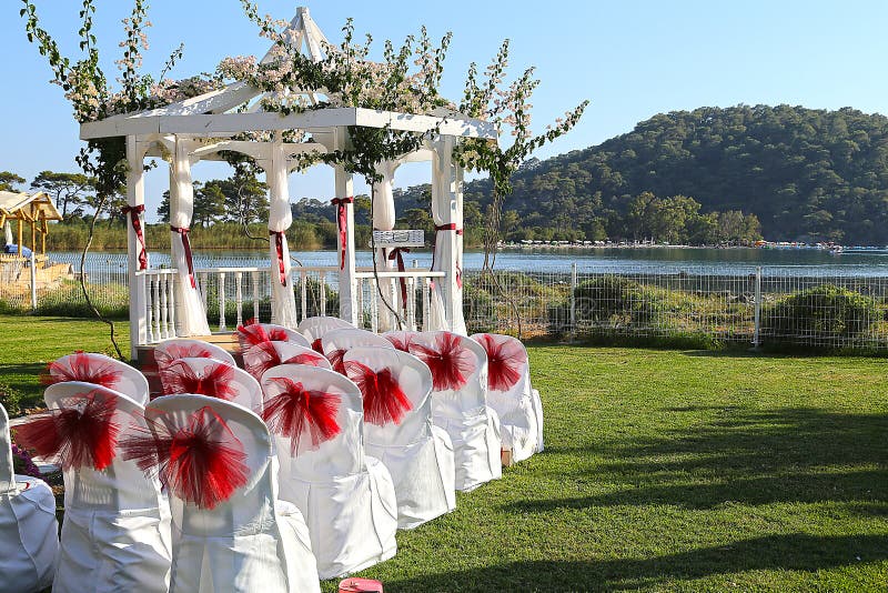 Image of an romantic outdoor style wedding venue setting. Image of an romantic outdoor style wedding venue setting.