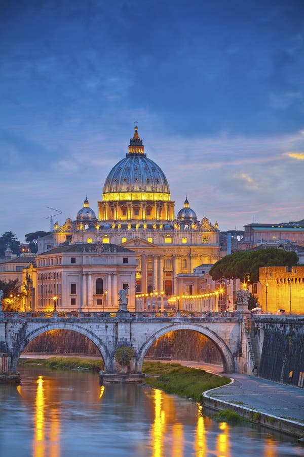 View of St. Peters cathedral in Rome, Italy during twilight blue hour.