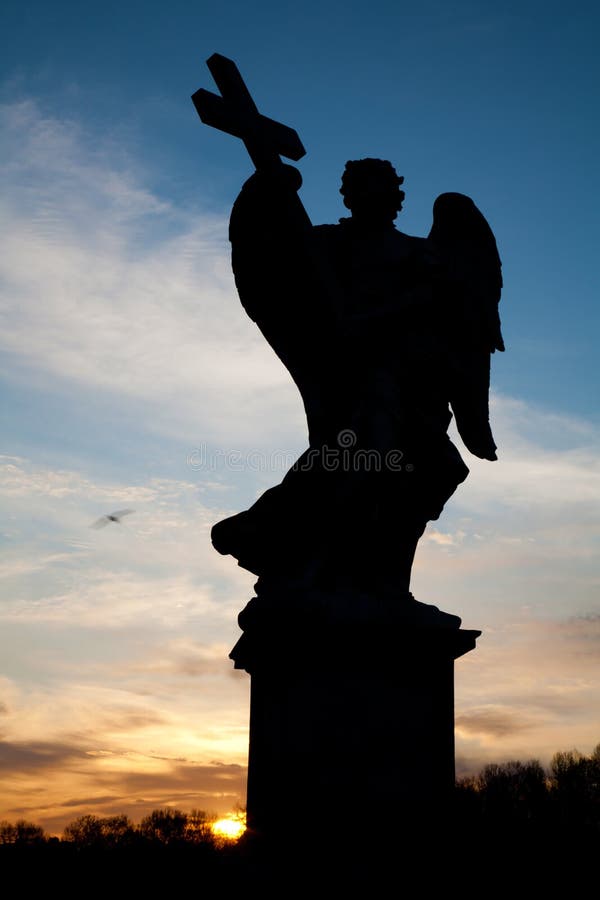 Rome - The angel with the cross silhouette from Angels bridge Ponte Sant Angelo - evening.