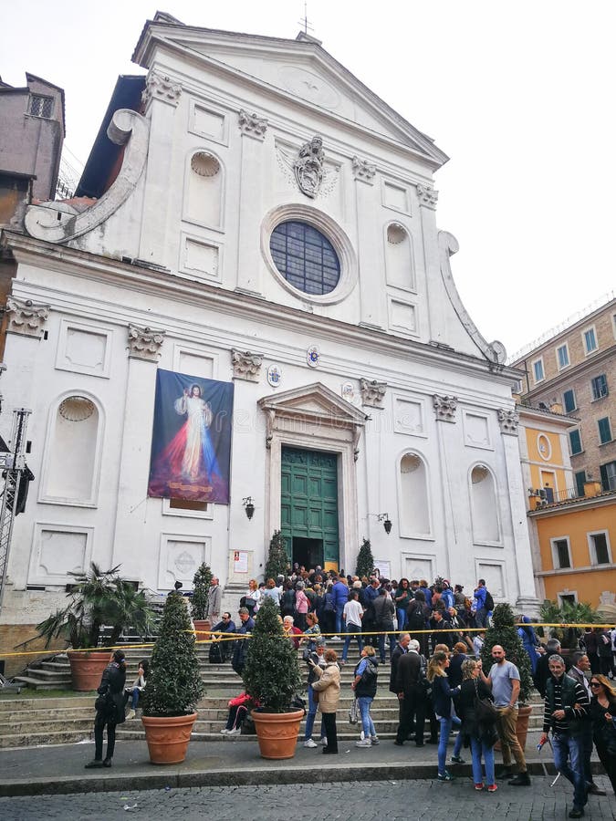 Group of worshipers in front of the Church. Rome, Italy.