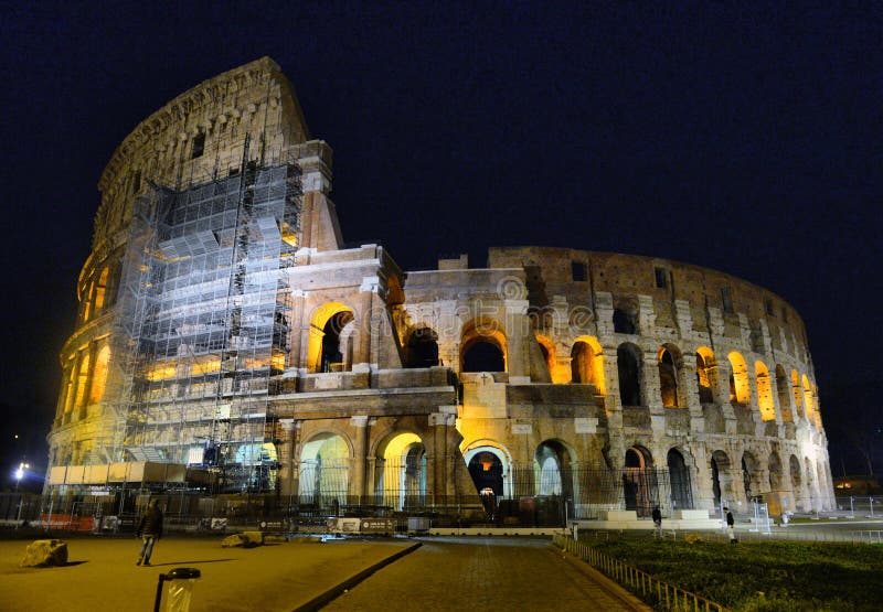 Rome, Italy. Colosseum Also Known As Flavian Amphitheatre In Evening Or Night Time. stock image Rome, Italy. Colosseum Also Known As Flavian Amphitheatre In Evening Or Night Time. stock image