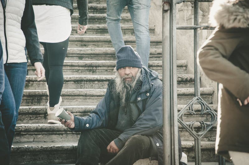 Rome, Italy - Dec 25, 2017 - Old homeless man sitting on the sta stock images Rome, Italy - Dec 25, 2017 - Old homeless man sitting on the sta stock images