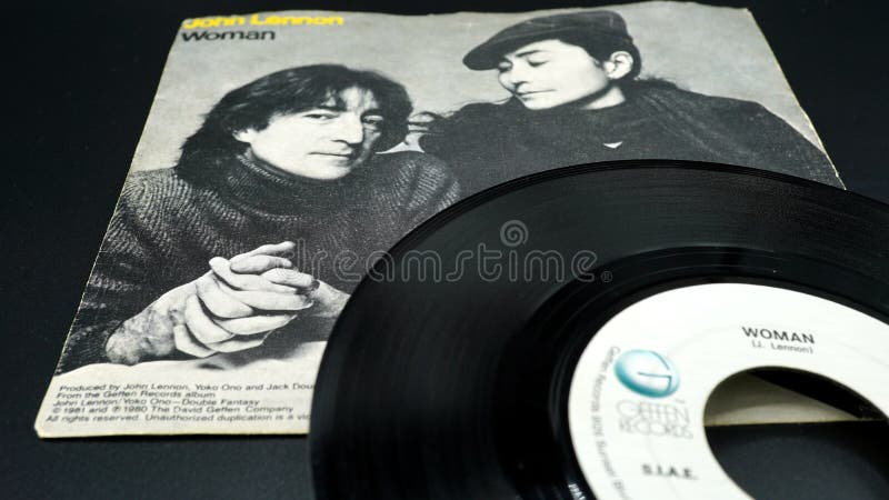 Cover and 45 rpm of the single WOMAN by John Lennon from 1981. he hears his wife YÅko Ono and the first posthumous release after