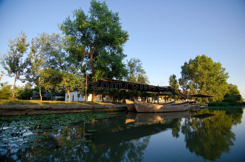 Old cannery in the Danube Delta, near Sfantu Gheorghe, Tulcea county. Called cherhana in Romanian - the building was the site where the fish was collected from the fishermen and prepared for shipping or canned. Old cannery in the Danube Delta, near Sfantu Gheorghe, Tulcea county. Called cherhana in Romanian - the building was the site where the fish was collected from the fishermen and prepared for shipping or canned.