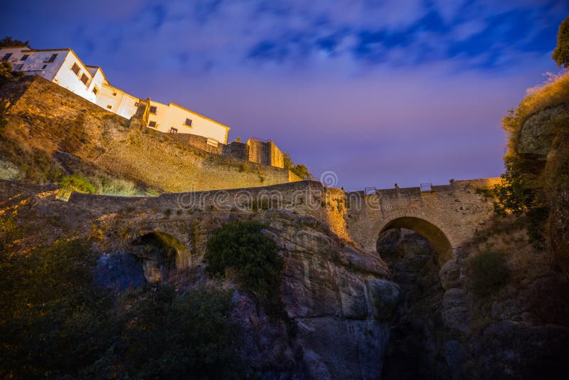 Archway Under blue sunrise sky - Ronda, Spain. Hdr bridge stock images, royalty-free photos and pictures