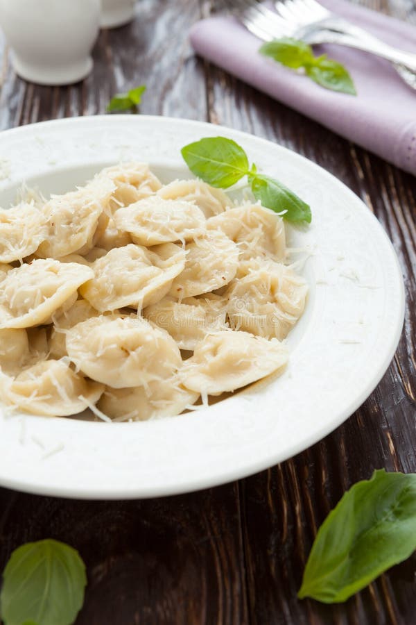 Round meat ravioli with grated parmesan cheese, food. Round meat ravioli with grated parmesan cheese, food