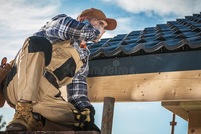 Roof Contractor Talking On Cell Phone