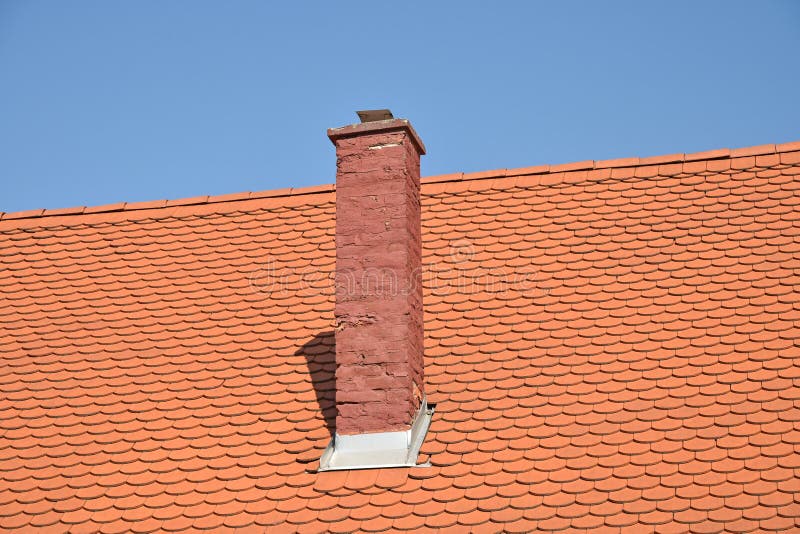 Roof of a house with smoke stack royalty free stock image