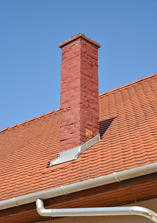 Roof of a house with smoke stack stock photography