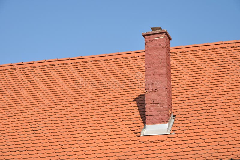 Roof of a house with smoke stack stock photo