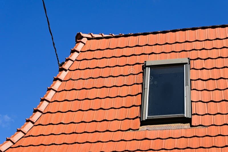 Roof of a house with window stock photo