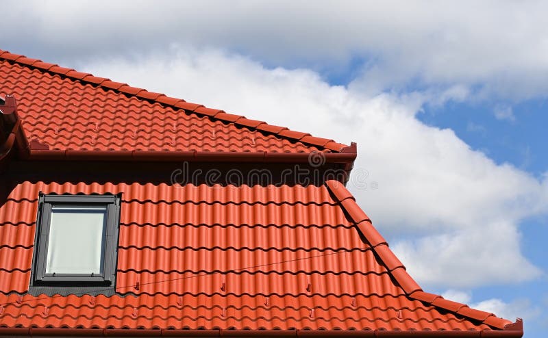 Roof of a house with window stock photography