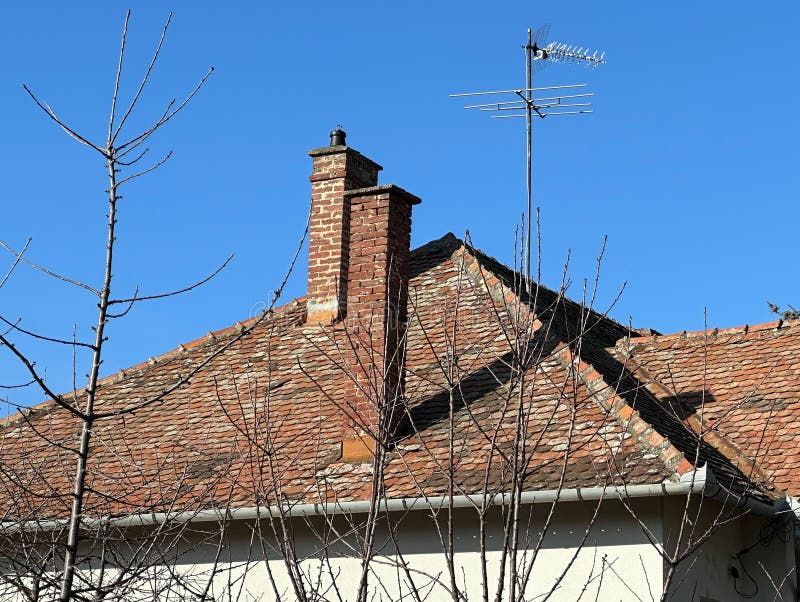 Roof of an old house in the city stock photos