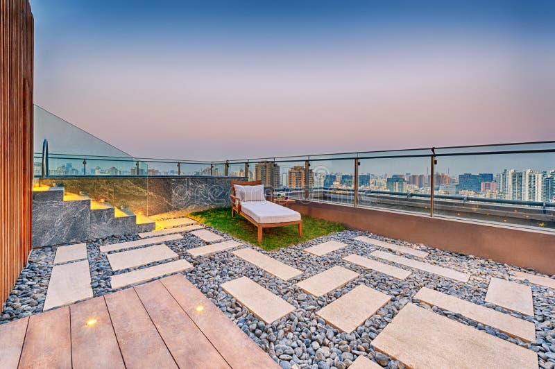 Roof terrace with jacuzzi and sun lounger royalty free stock photography