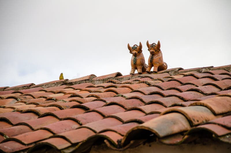 Roof top bulls at Pukara, peru. Roof top bulls are supposed to bless the house and bring good fortune to its inhabitants royalty free stock photography Roof top bulls at Pukara, peru. Roof top bulls are supposed to bless the house and bring good fortune to its inhabitants royalty free stock photography