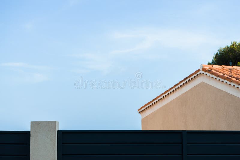 Roof of a yellow house against a blue sky background side view royalty free stock photography Roof of a yellow house against a blue sky background side view royalty free stock photography